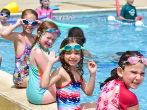 a group of children in a pool