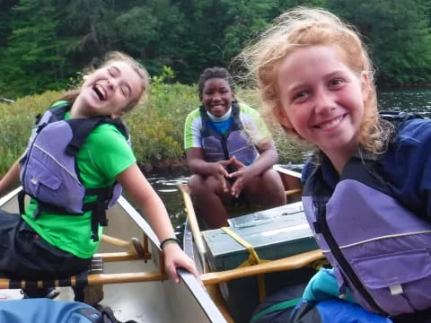 a group of people in a canoe