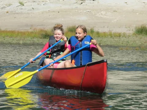 two kids in a raft