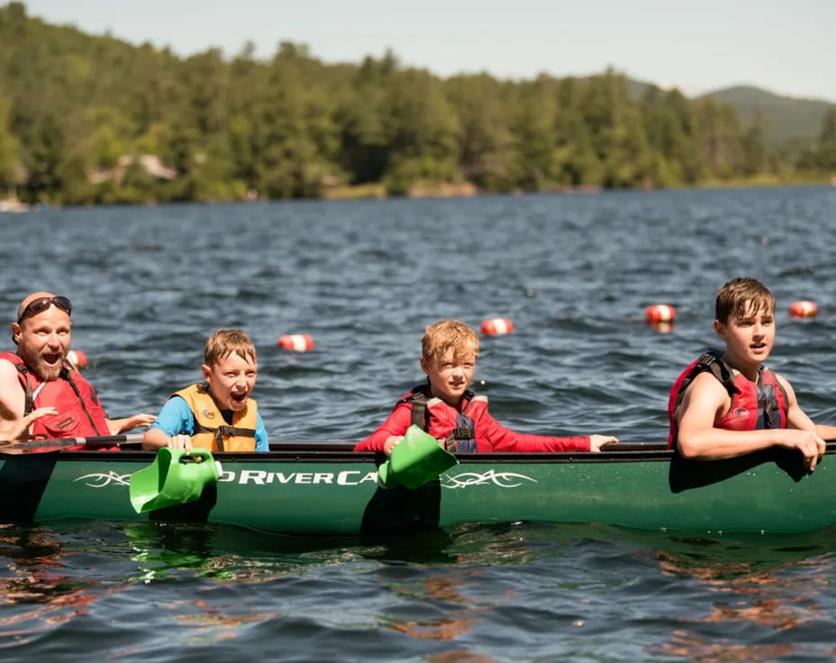 a group of people in a canoe