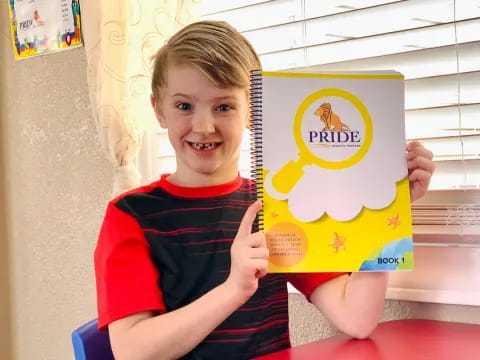 a boy holding a sign