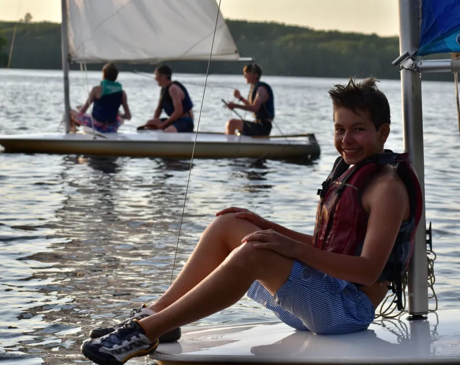 a woman sitting on a boat