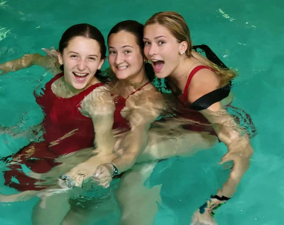 a group of women in a pool