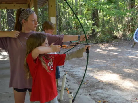 a man holding a bow and arrow