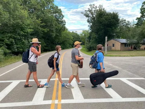 a group of people standing in a parking lot