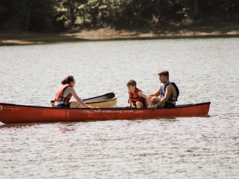 a group of people in a canoe