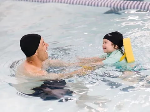 a man and woman in a pool