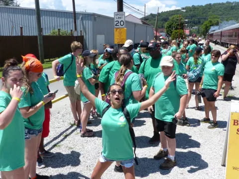 a group of people in green shirts