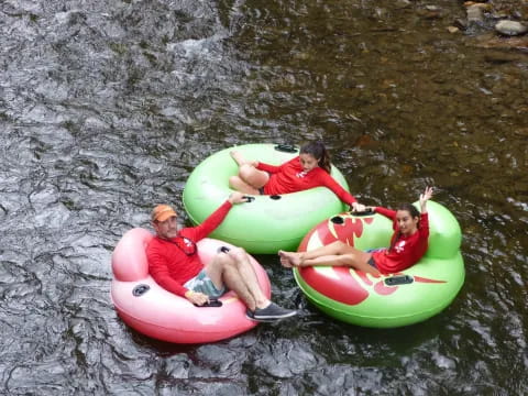 a group of people in kayaks on a river