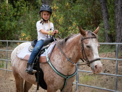 a girl riding a horse