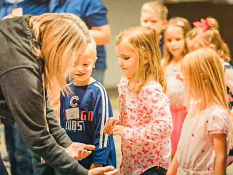 a person and a group of children