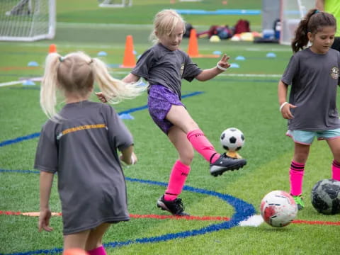 girls playing football on a field