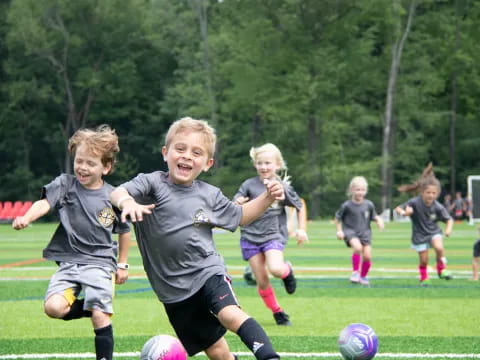 kids playing football on a field