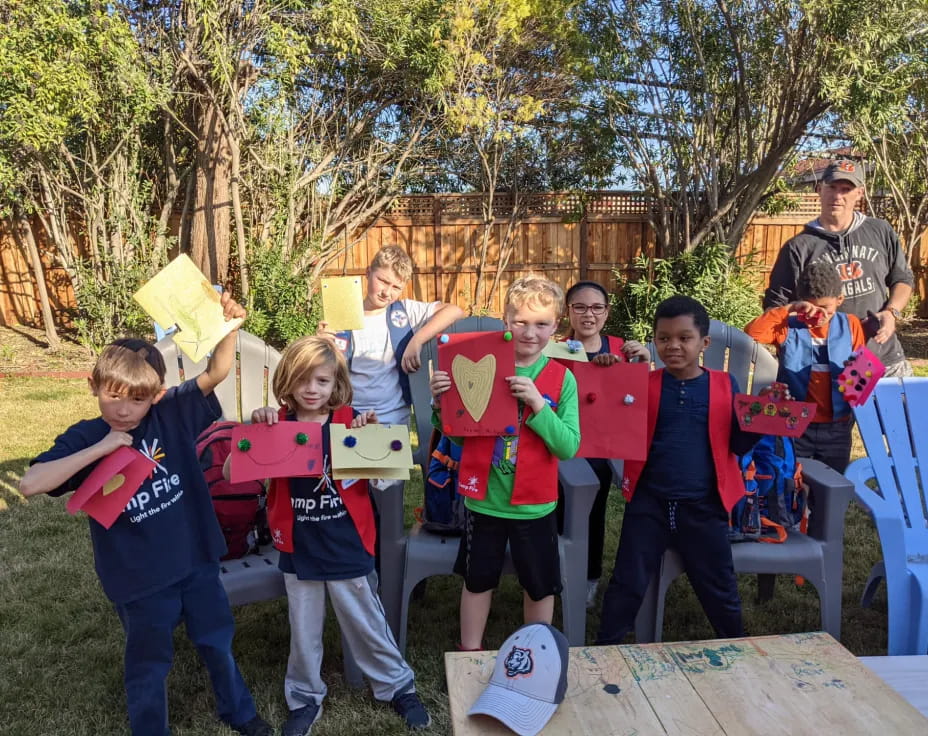 a group of people holding objects