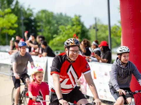 a group of people riding bikes