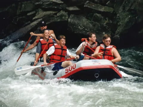 a group of people in a raft