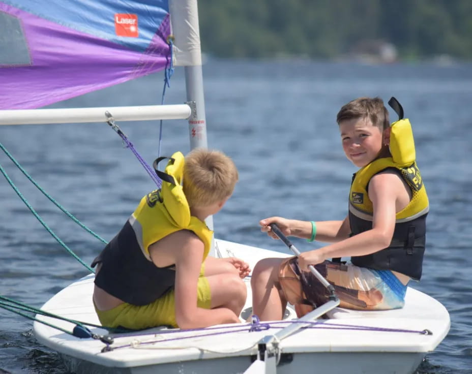 a couple of kids on a boat