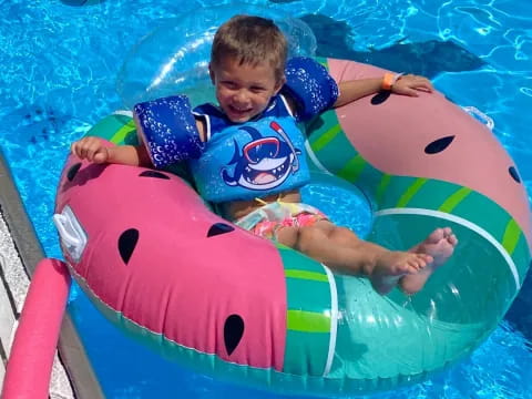 a boy in a pool