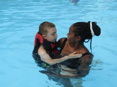 a boy and a dog in the water