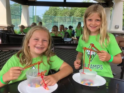 girls eating cake at a table