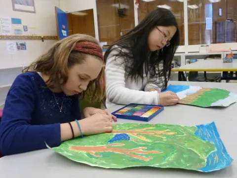a few young girls painting