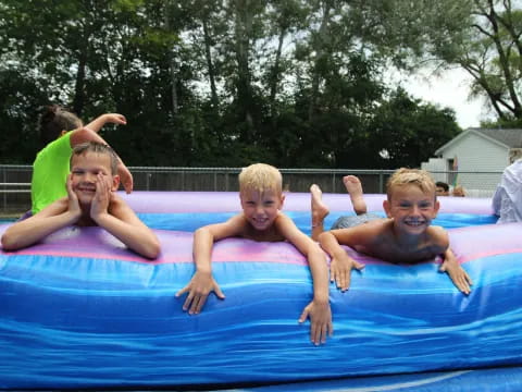 a group of children in a pool