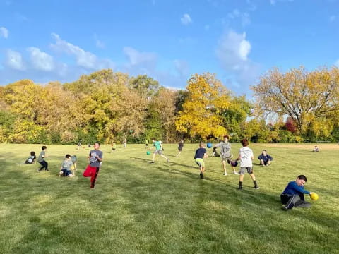 a group of people playing football