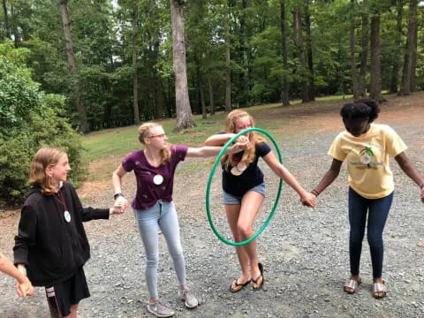 a group of women holding a rope