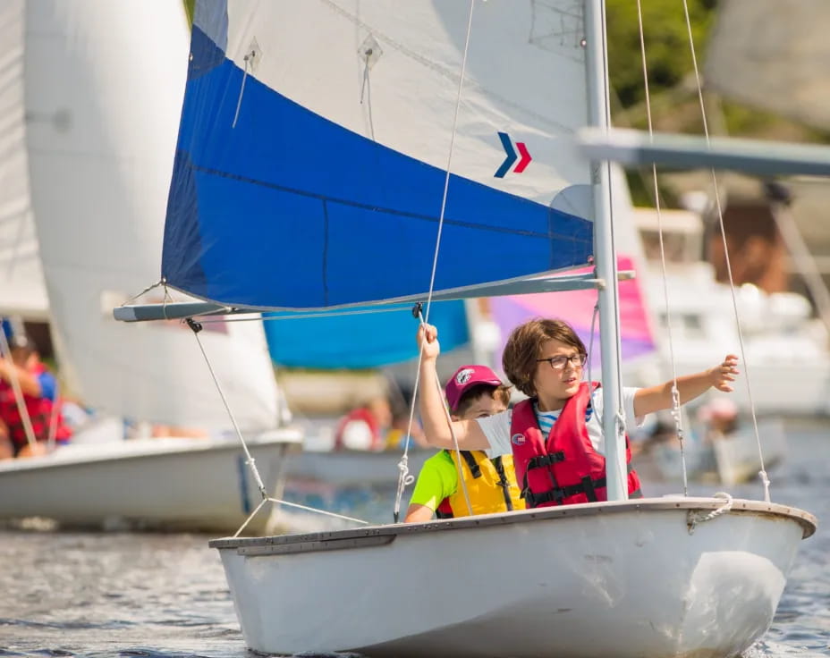 a group of people on a sailboat