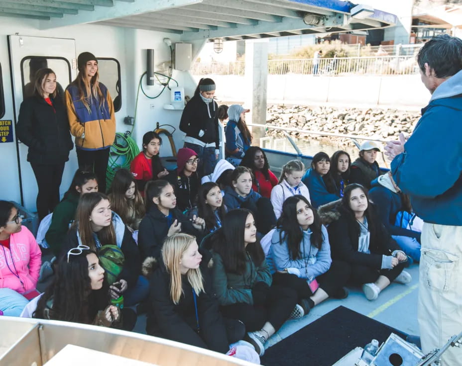 a group of people sitting on a bus