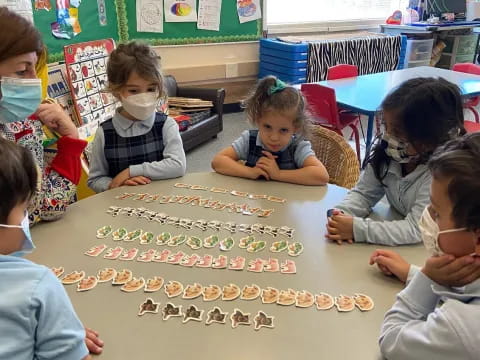 a group of children playing a board game