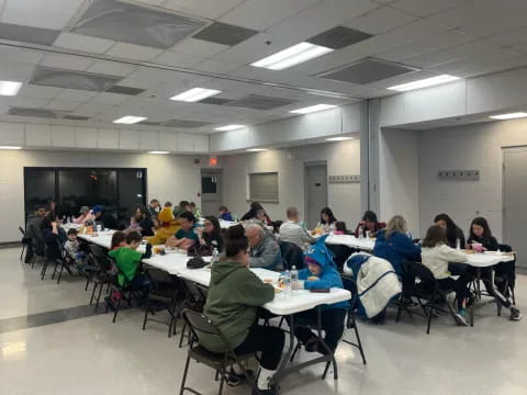 a group of people sitting at tables