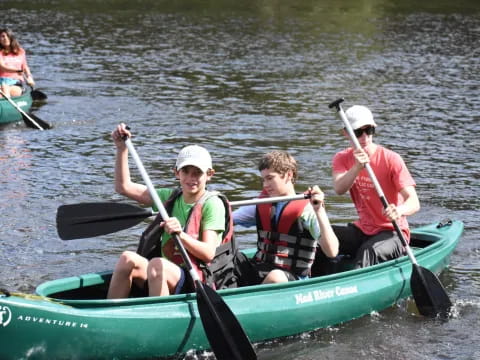 a group of people in a canoe