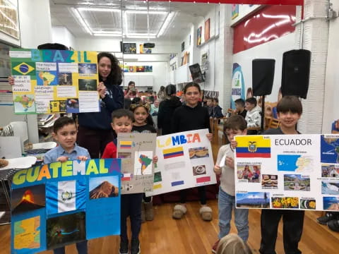 a group of children holding signs