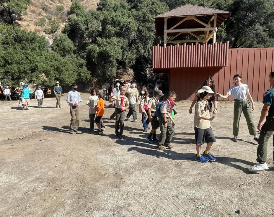 a group of people walking outside