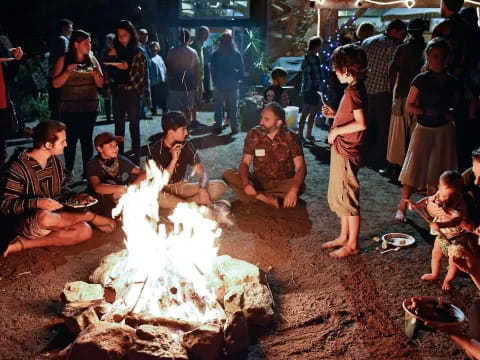a group of people around a fire