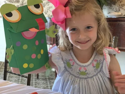 a girl sitting at a table