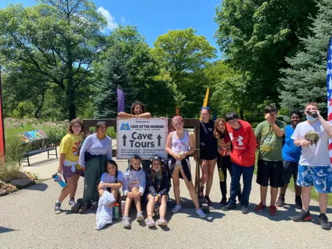 a group of people holding a sign