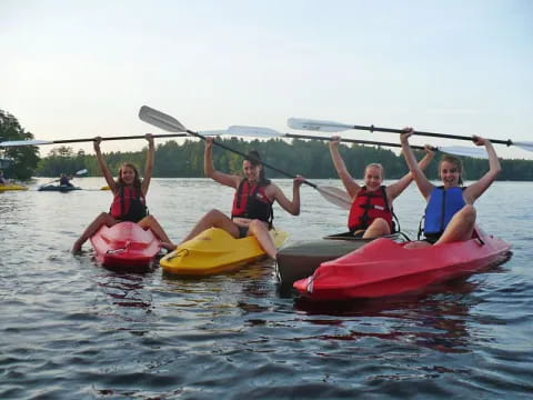 a group of people in kayaks