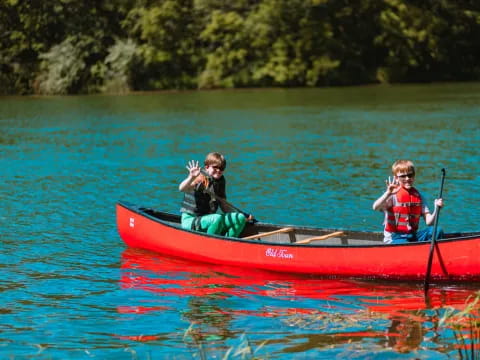 a couple of people in a canoe