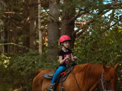 a girl riding a horse