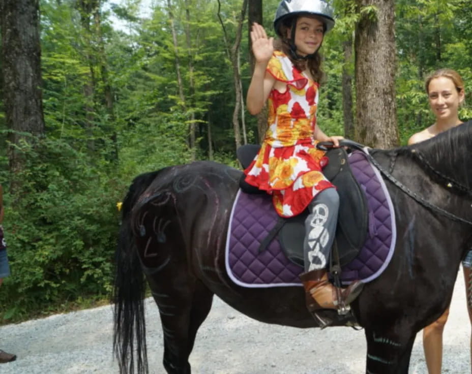 a girl riding a horse