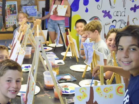 a group of children painting