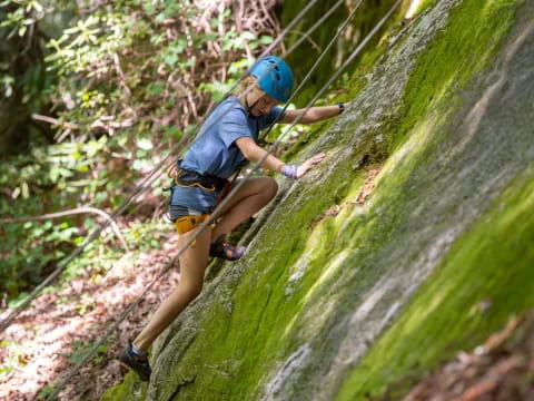 a person climbing a rock