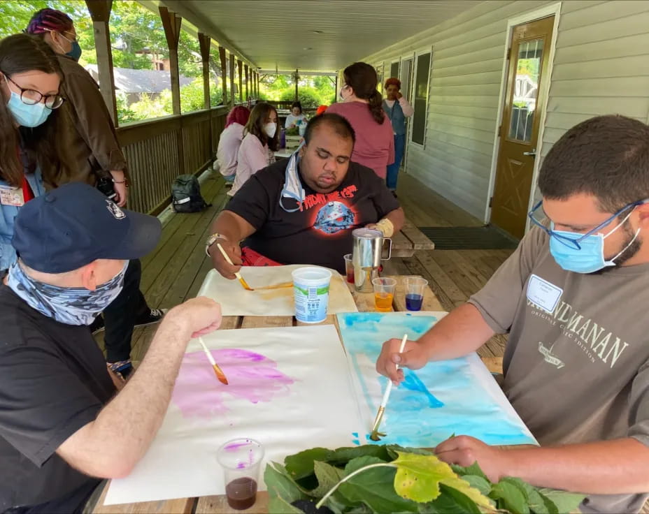 a group of people painting