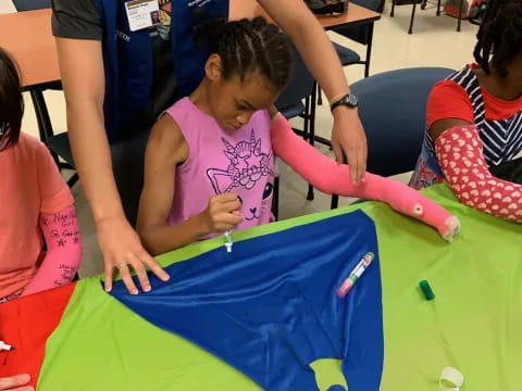 a group of children painting
