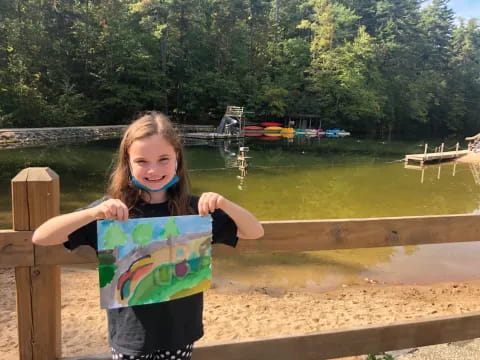 a girl holding a sign