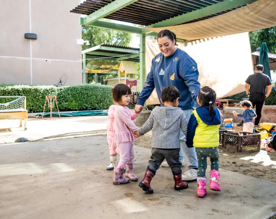 a person and children walking
