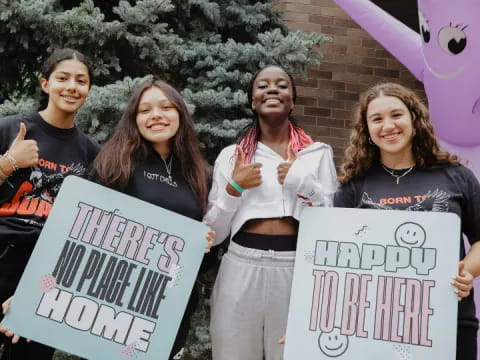 a group of people holding signs