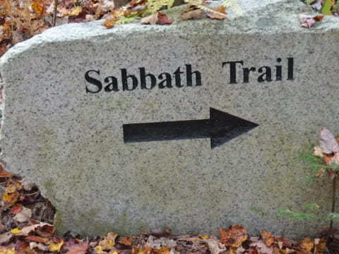 a stone with a sign on it